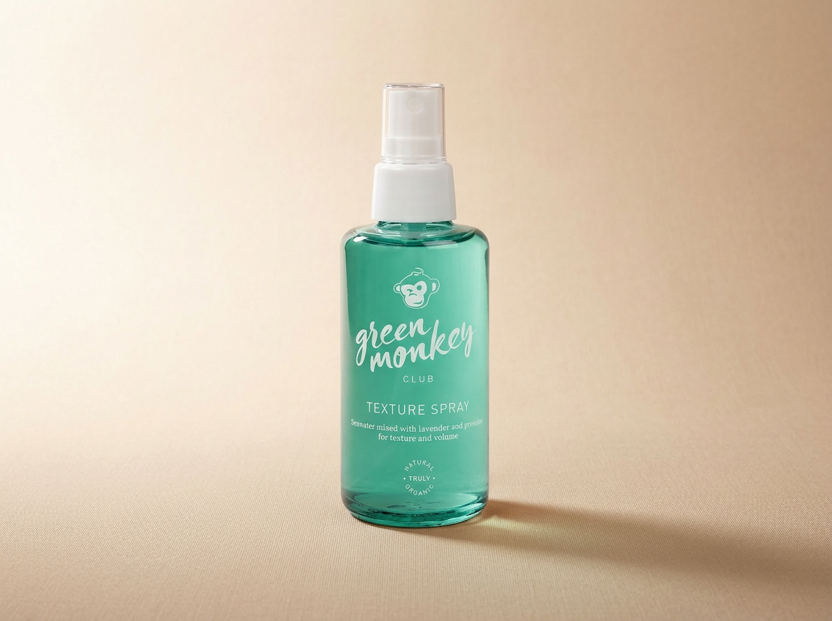 Green Monkey premium haircare bottle on wet stone
